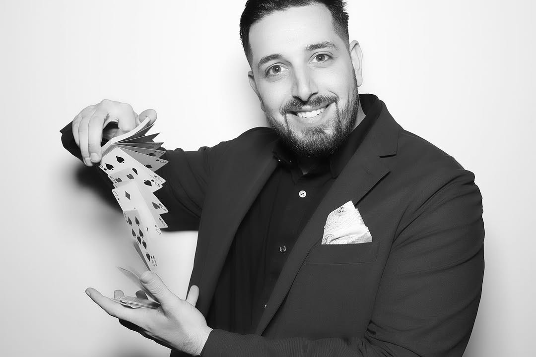 Daniel Nicholas card flourish portrait — black and white