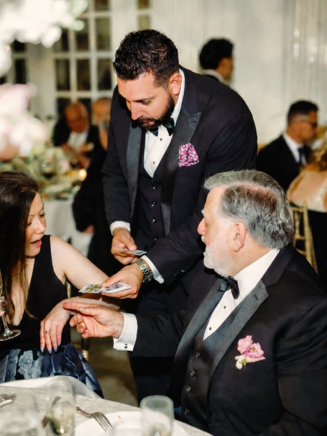 Daniel Nicholas performing close-up magic at wedding reception